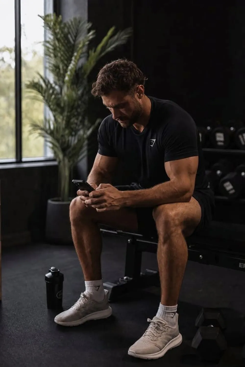 Athlete checking their workout plan on a phone at home